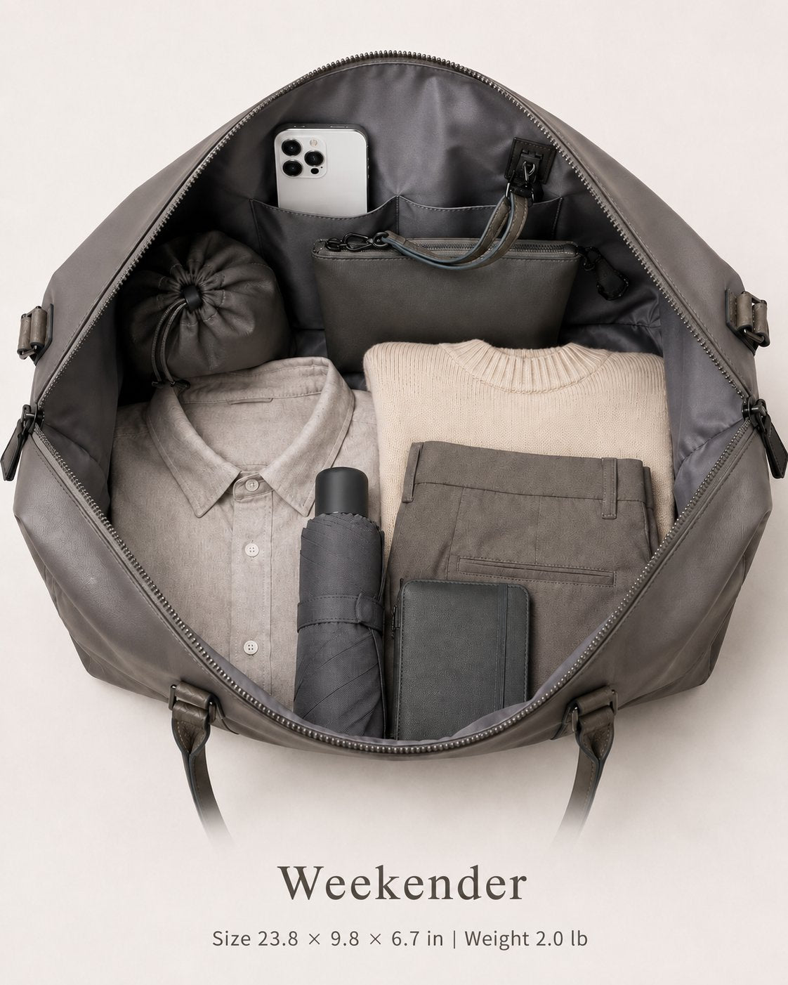 Layrich Weekender Travel Bag for women packed with clothes, phone, pouch, umbrella and organizer, showing a spacious carry-on interior.